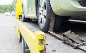 car-transporter-breakdown-lorry-working-using-locked-belt-transport-other-green-car_1150-6453